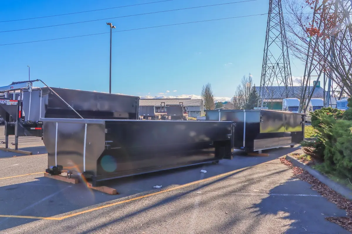 Roll-off dumpster ready for waste disposal at job site for Concrete Dumpster Rental in Crafton